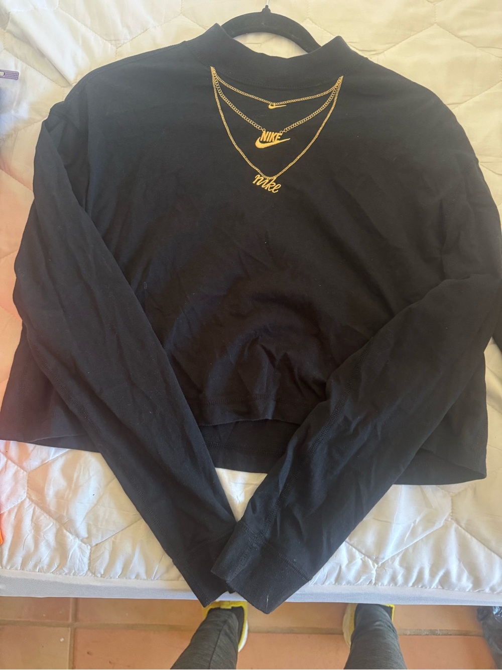 Nike Black Long-Sleeve Cropped Mock Neck Top with Gold Logo Detail